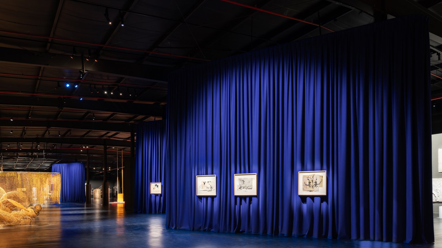 After Rain, Diriyah Contemporary Art Biennale 2024, installation view, Asma Bahmim, works  from the series Fantasia (2022); works by Sopheap Pich, El Anatsui, Sara Abdu, and  Rossella Biscotti in background.